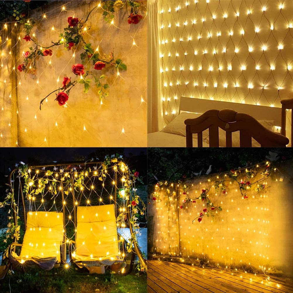 Net lights decorating a wall, patio seating area, and outdoor gathering space
