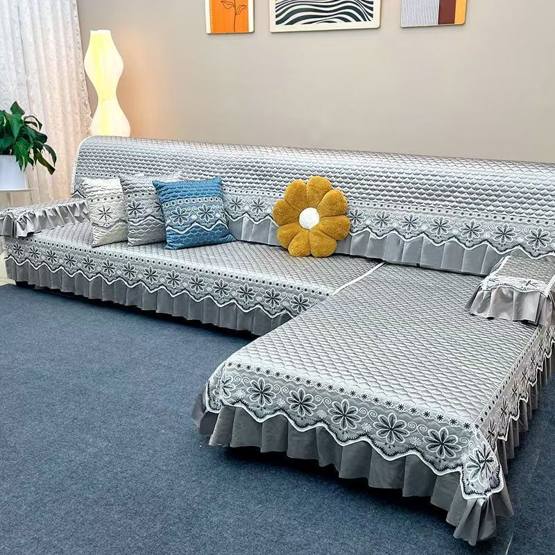 Elegant quilted sofa cover creating a cozy living room atmosphere