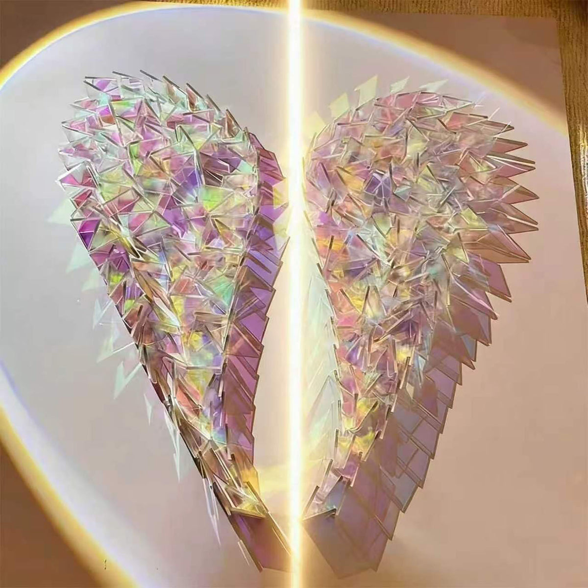 Holographic acrylic tiles arranged into colorful heart shaped artwork