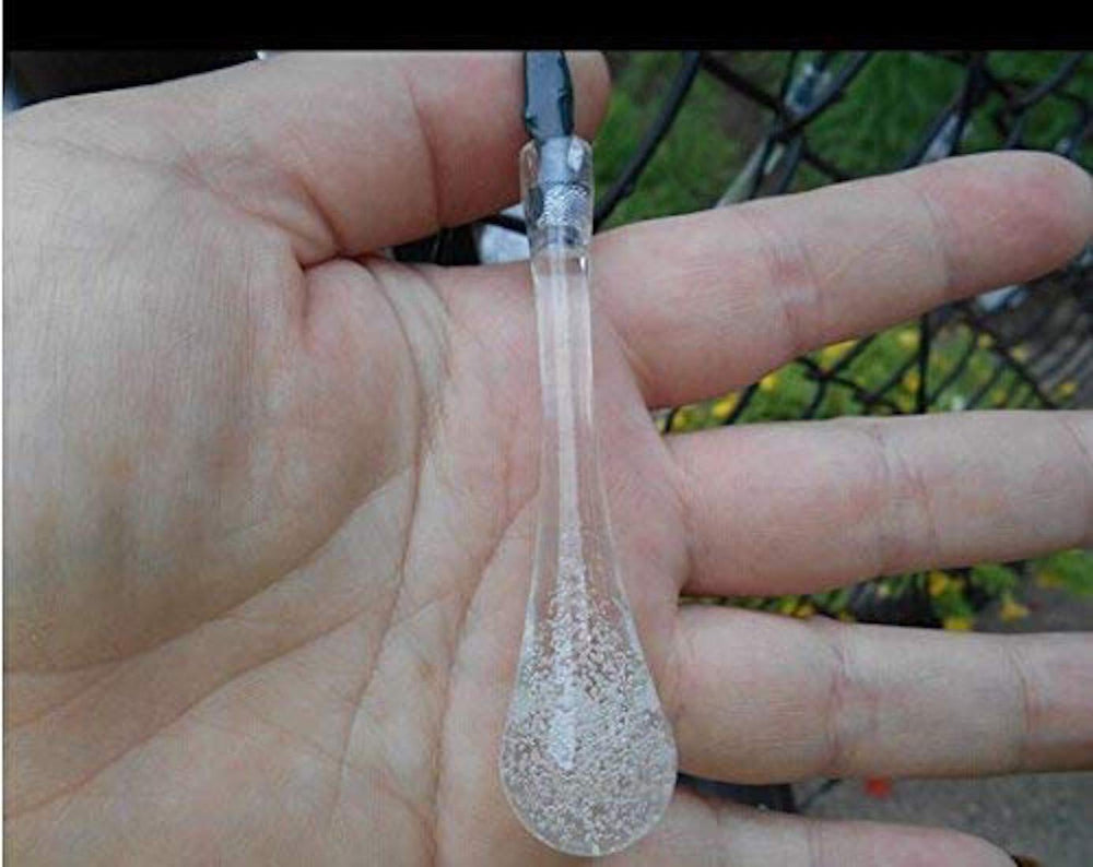 Crystal Drop LED Light shown in hand for scale