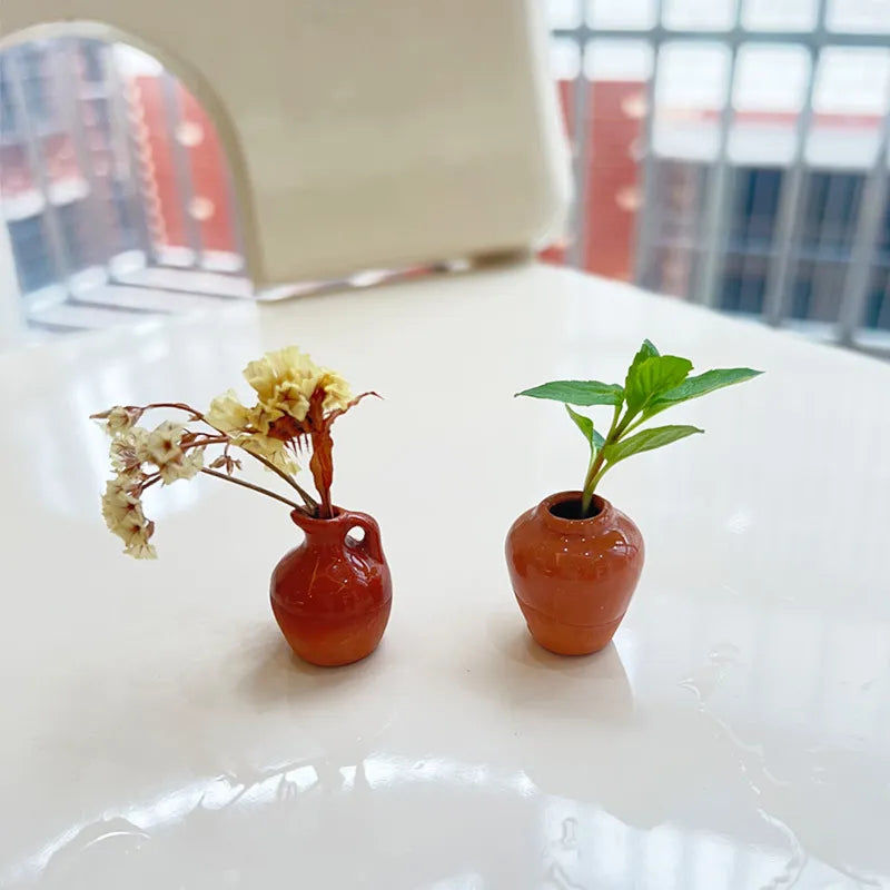 Two small vase magnets with dried flowers and greenery
