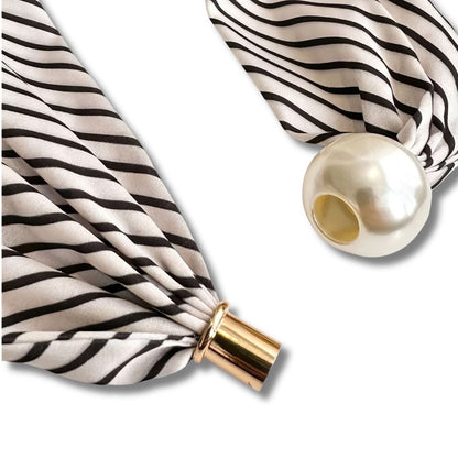 Elegant pearl scarf necklace worn around the neck