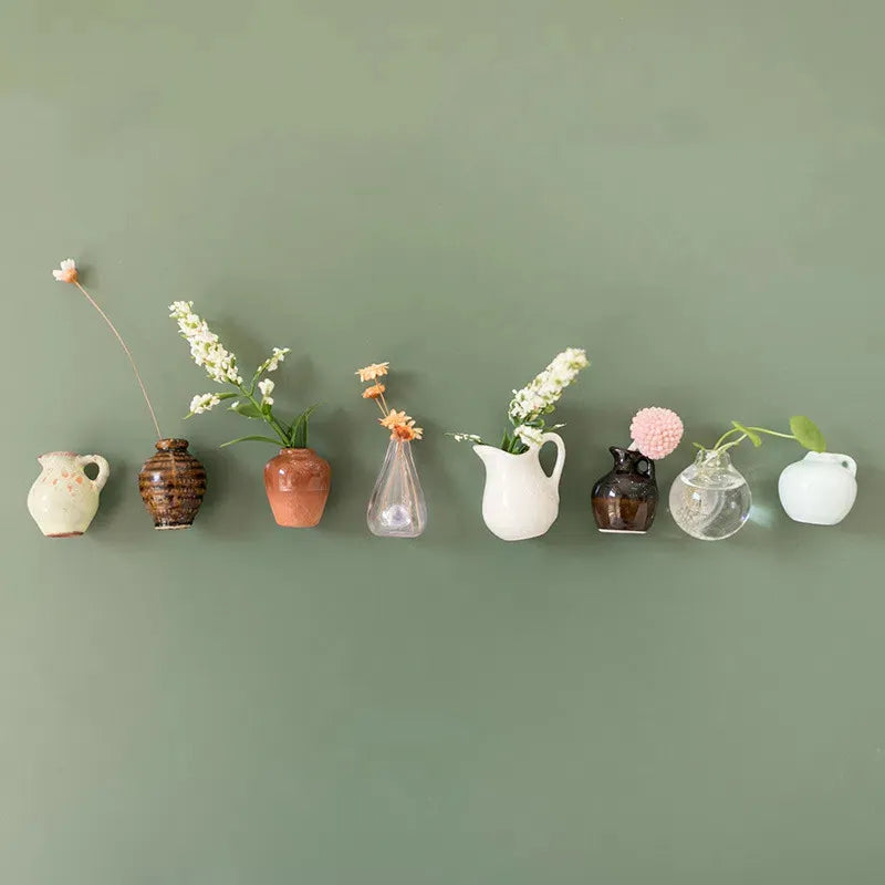 Mini magnetic vase collection on green wall